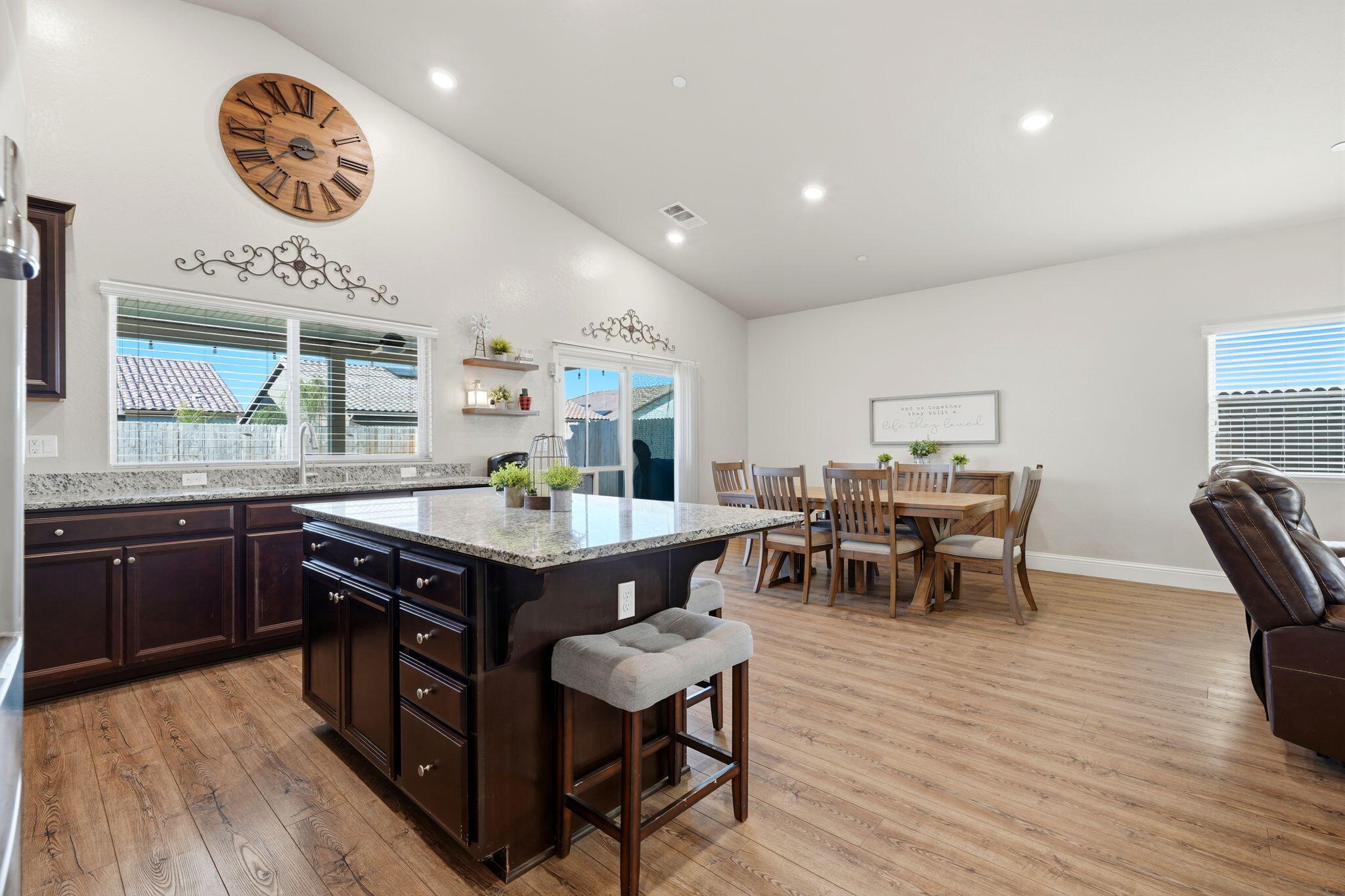 756 Strada Street Lemoore, CA 93245 - Photo 17 of 53 a kitchen with a table and chairs in it