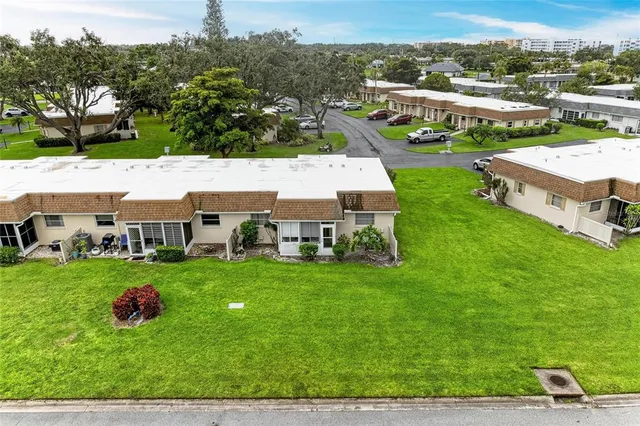 a aerial view of a house with table and chairs