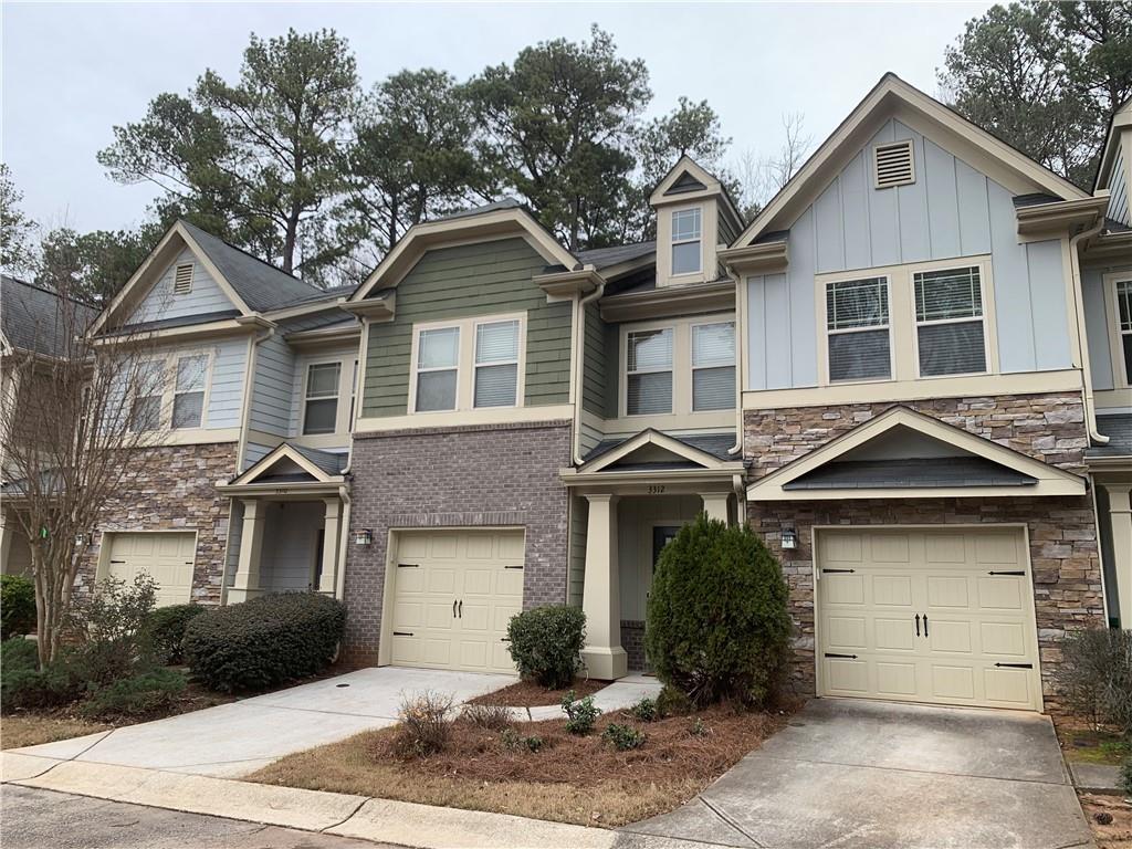 3312 Erin Circle Decatur, GA 30032 - Photo 1 of 1 a front view of a house with a yard and garage