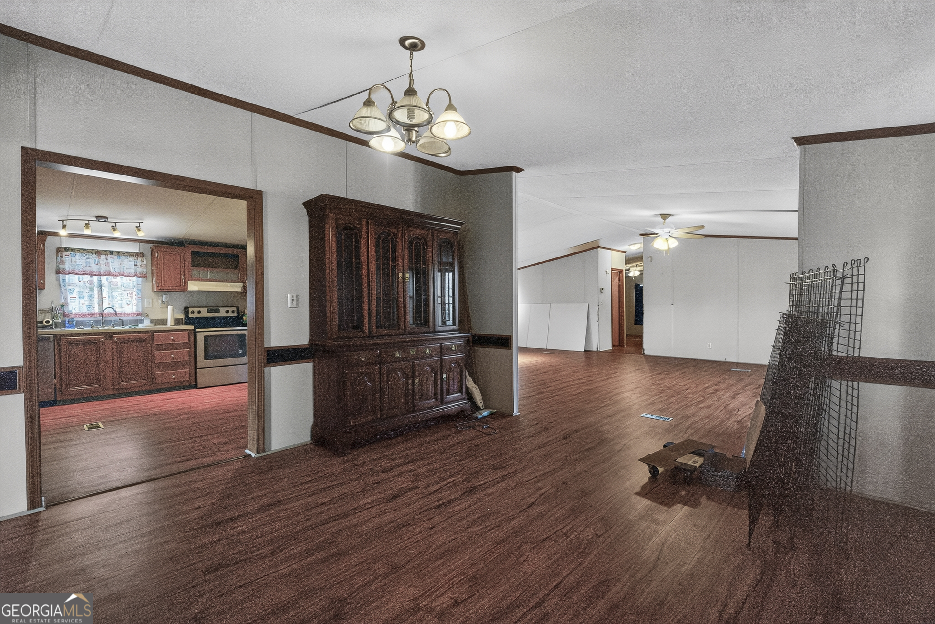 157 Linstead Drive Macon, GA 31216 - Photo 11 of 42 a view of a living room and kitchen with wooden floor