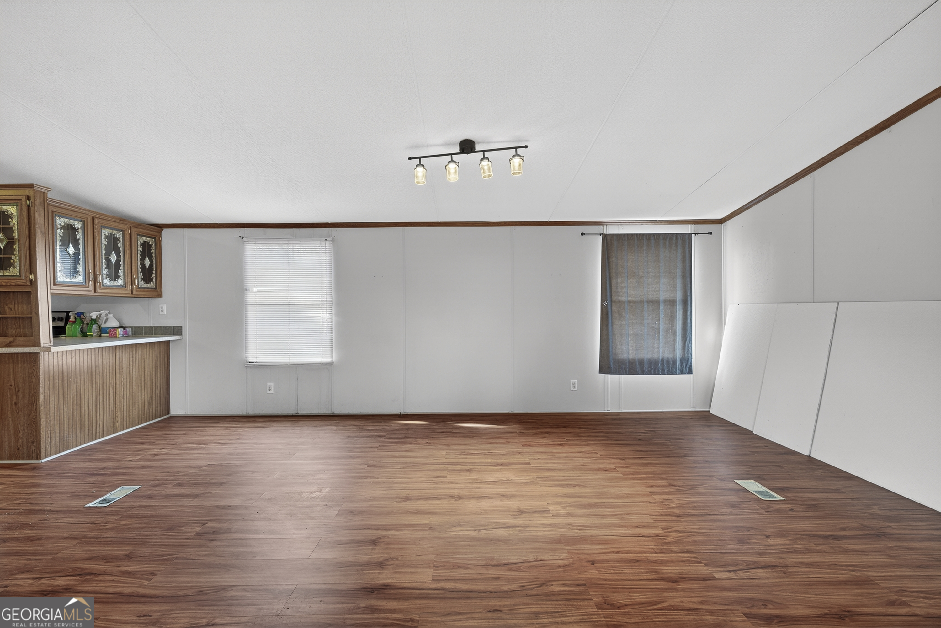 157 Linstead Drive Macon, GA 31216 - Photo 12 of 42 a view of a kitchen with wooden floor and a window
