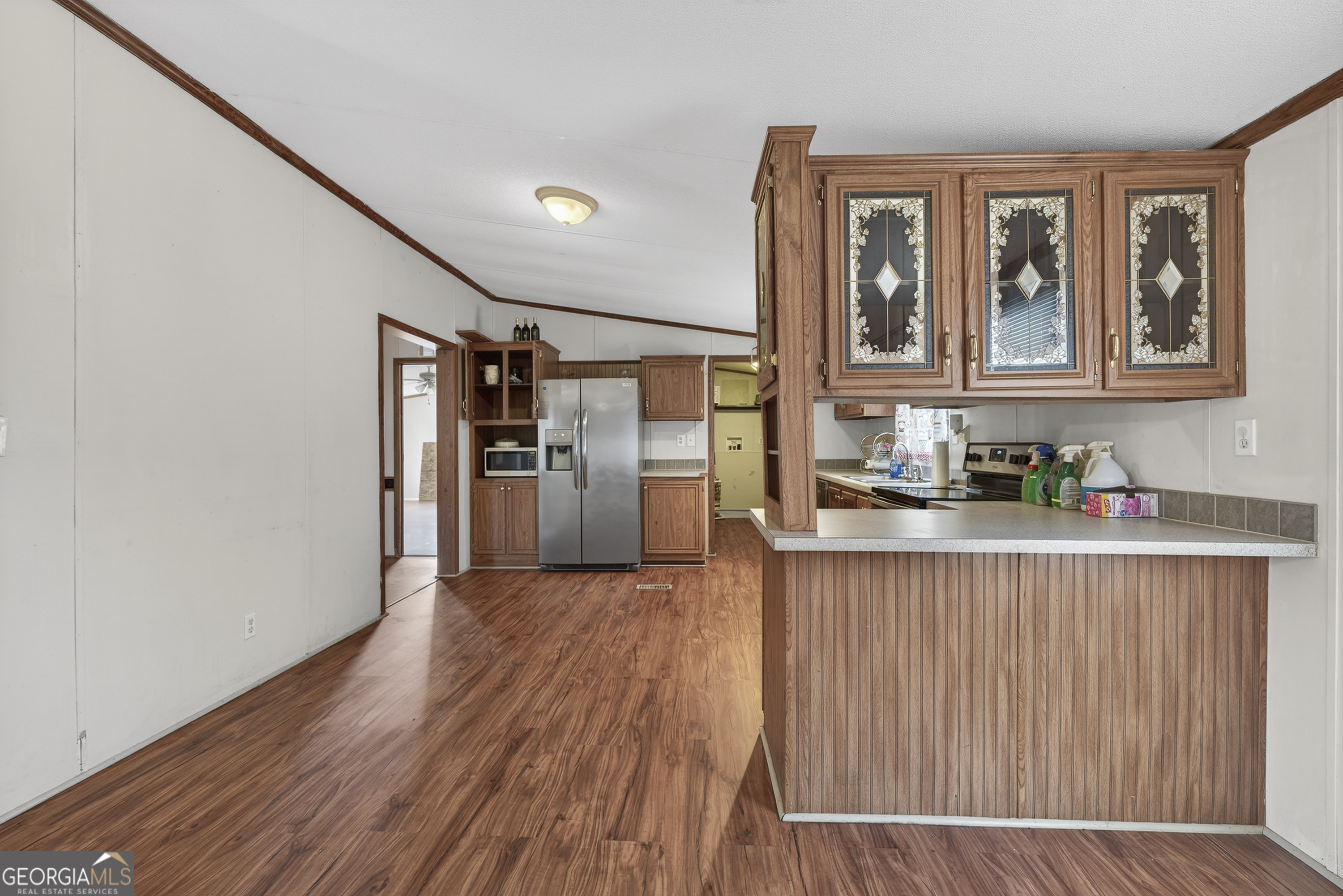 157 Linstead Drive Macon, GA 31216 - Photo 16 of 42 a kitchen with stainless steel appliances granite countertop a refrigerator and a stove top oven