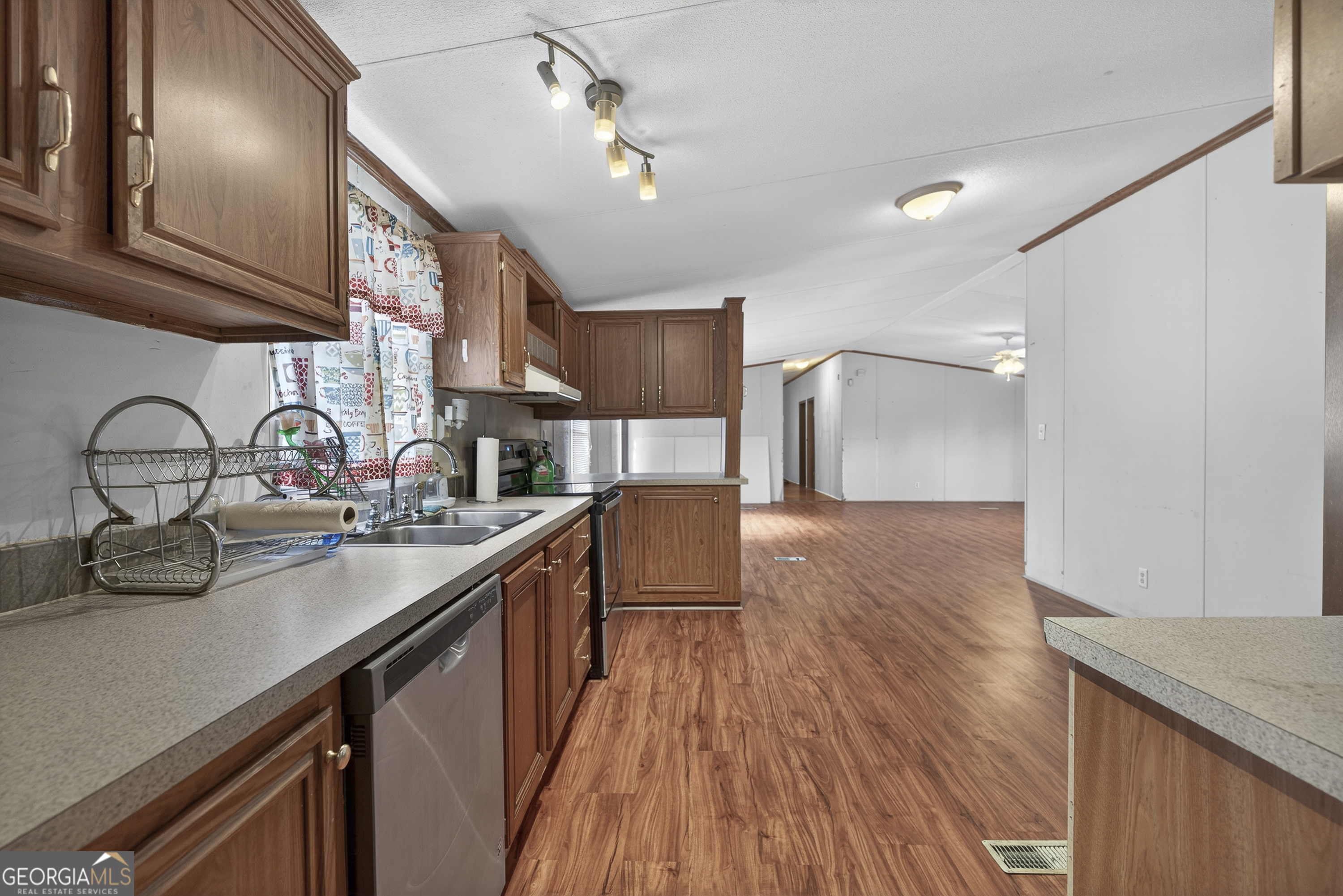 157 Linstead Drive Macon, GA 31216 - Photo 19 of 42 a kitchen with sink cabinets and wooden floor