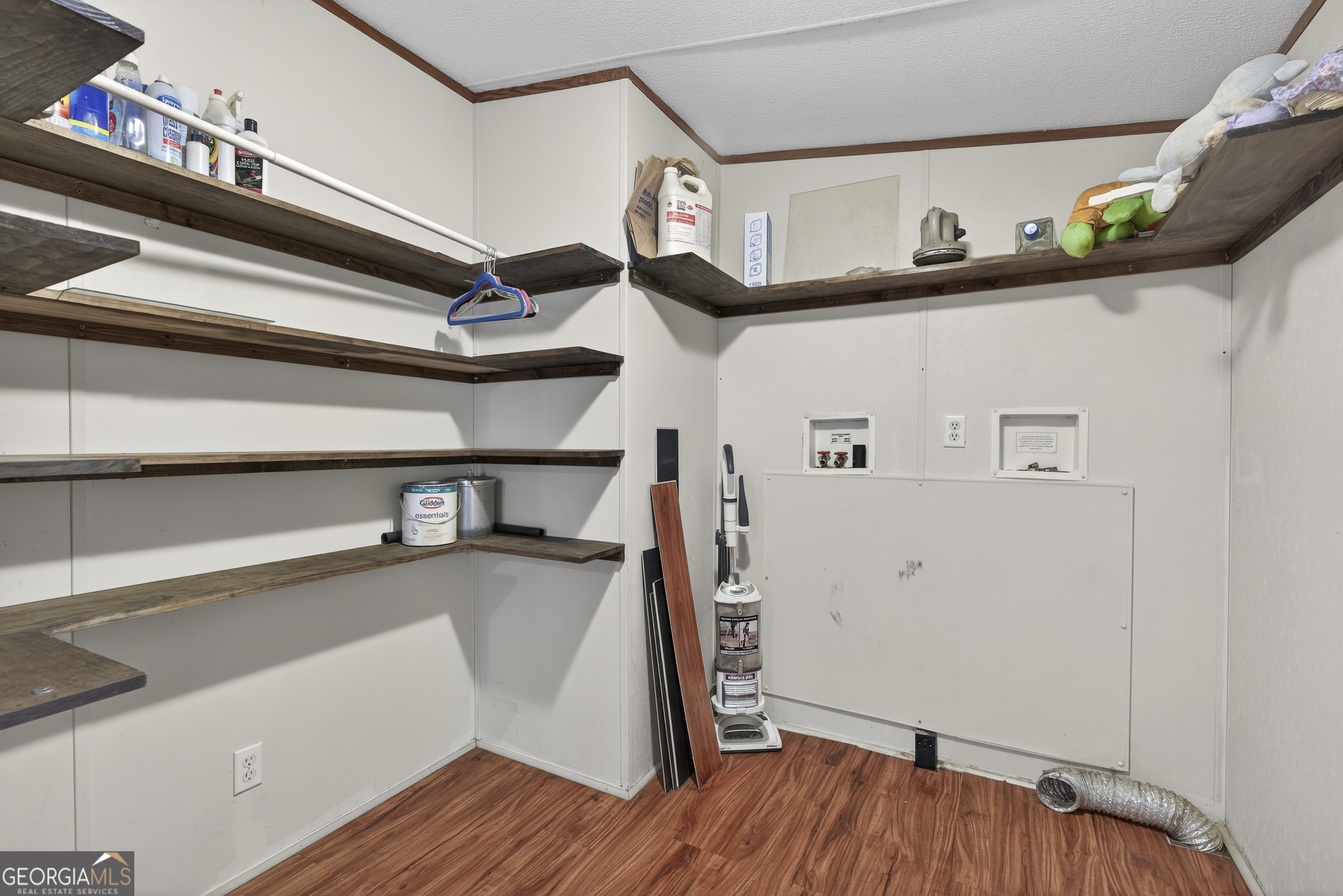 157 Linstead Drive Macon, GA 31216 - Photo 20 of 42 a view of a storage & utility room with wooden floor