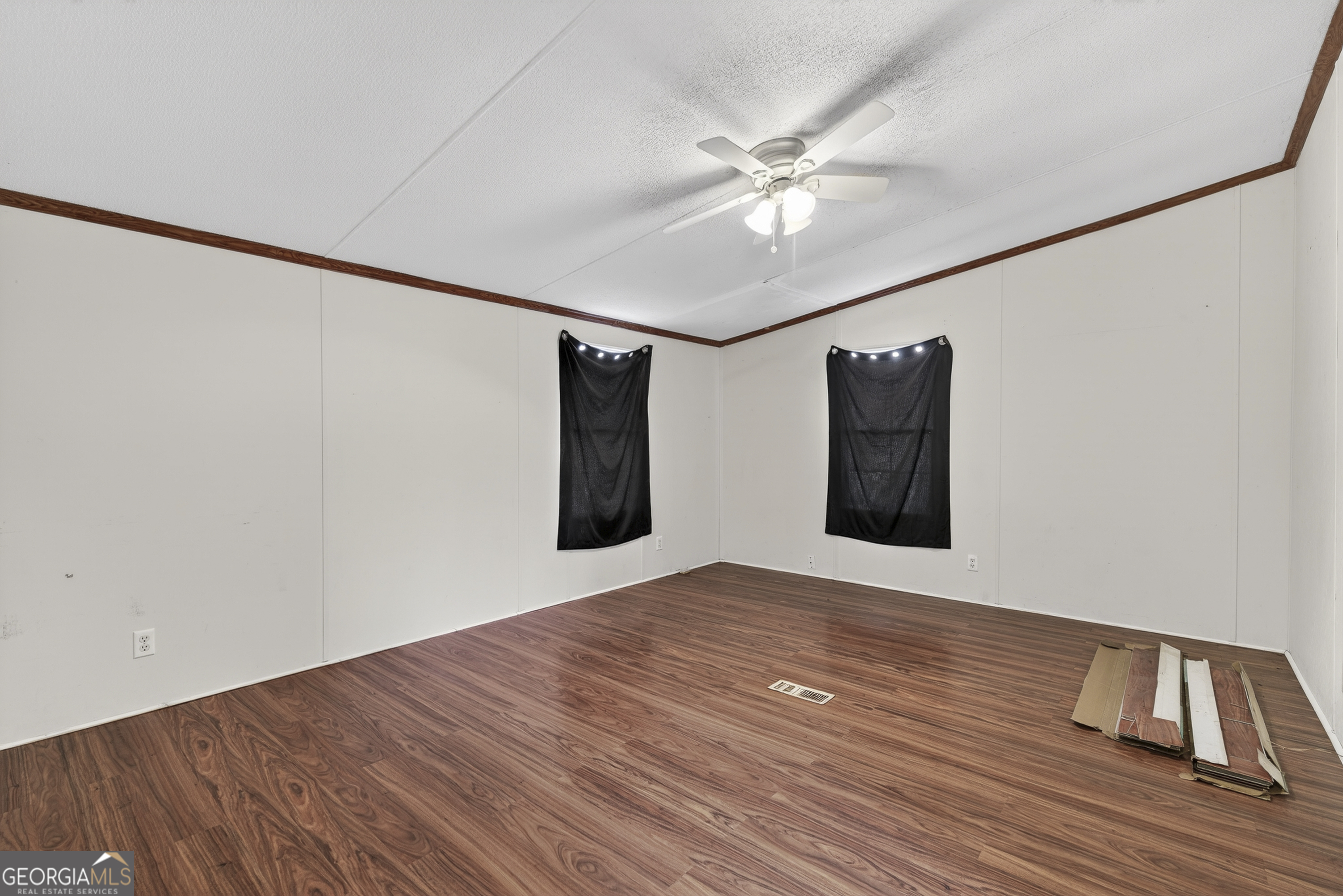 157 Linstead Drive Macon, GA 31216 - Photo 23 of 42 a view of an empty room with wooden floor and a ceiling fan