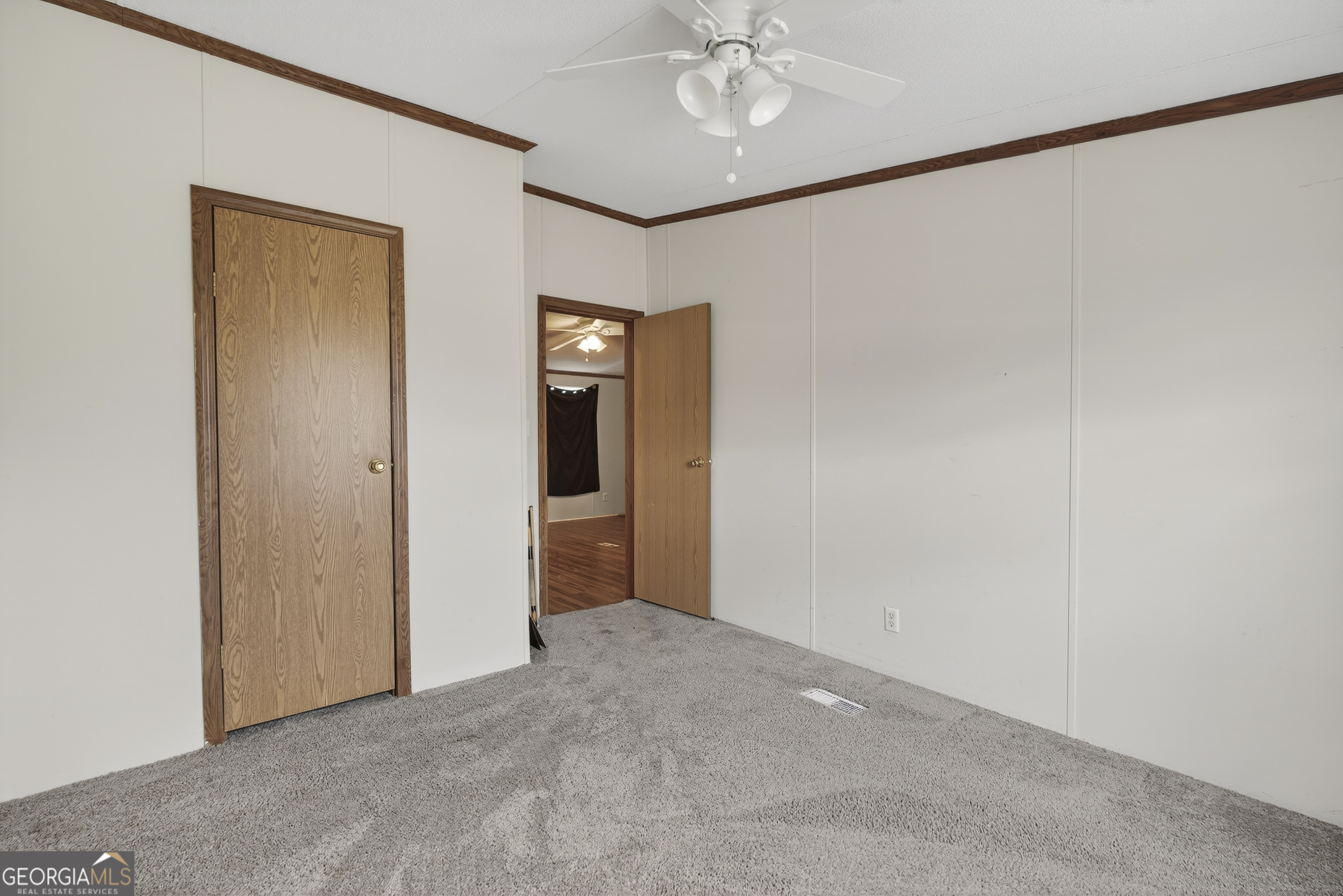 157 Linstead Drive Macon, GA 31216 - Photo 28 of 42 a view of a hallway with a chandelier fan