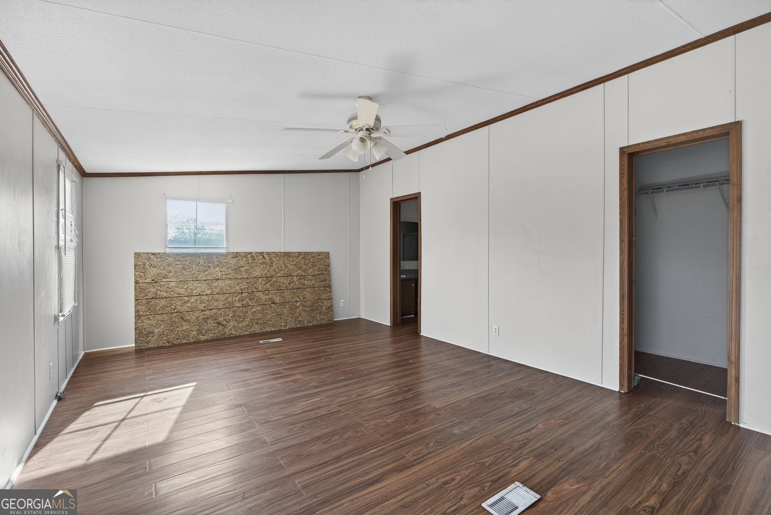 157 Linstead Drive Macon, GA 31216 - Photo 30 of 42 a view of an empty room with wooden floor and a window