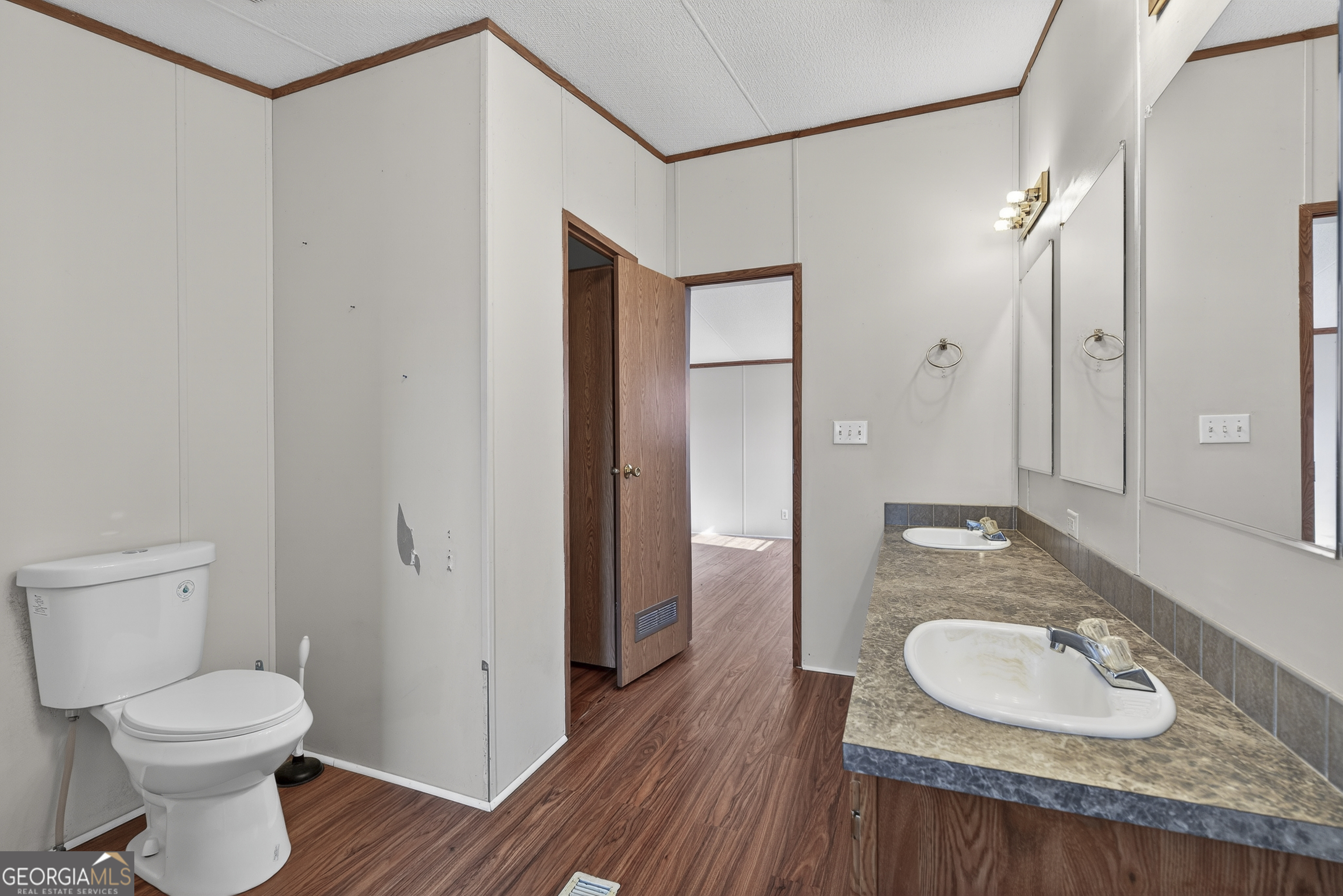 157 Linstead Drive Macon, GA 31216 - Photo 33 of 42 a bathroom with a granite countertop sink toilet and shower