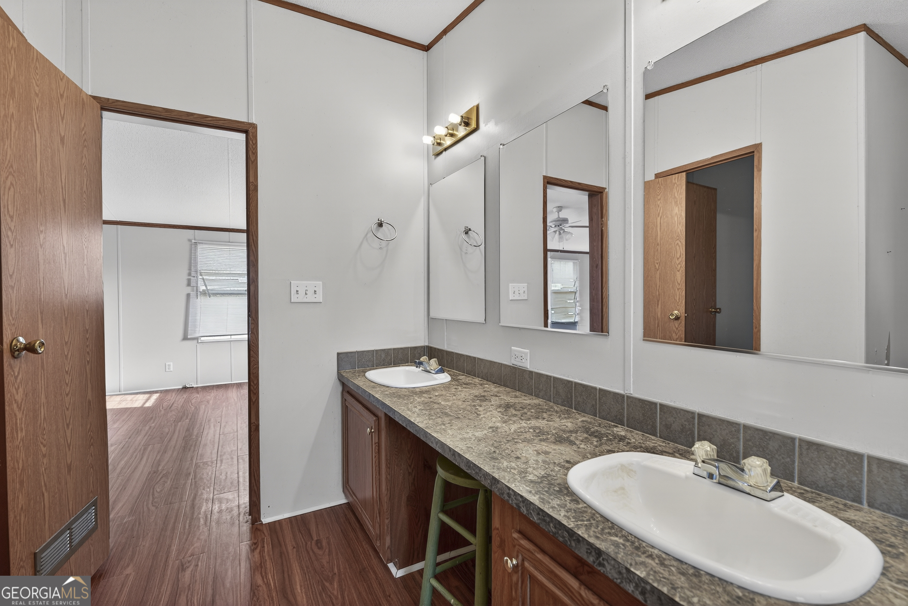 157 Linstead Drive Macon, GA 31216 - Photo 34 of 42 a bathroom with a granite countertop sink a mirror and shower