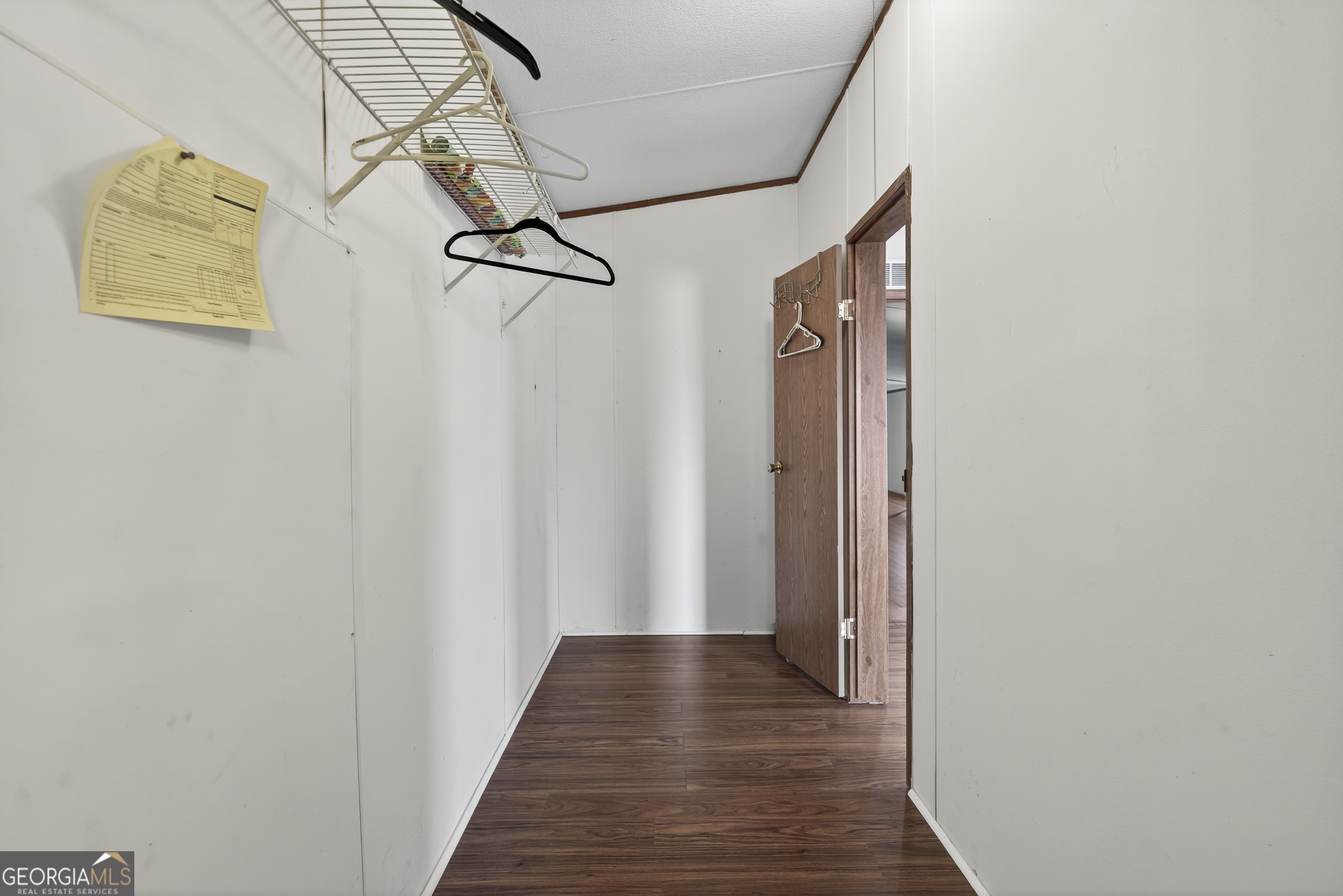 157 Linstead Drive Macon, GA 31216 - Photo 36 of 42 a view of a hallway with wooden floor and staircase