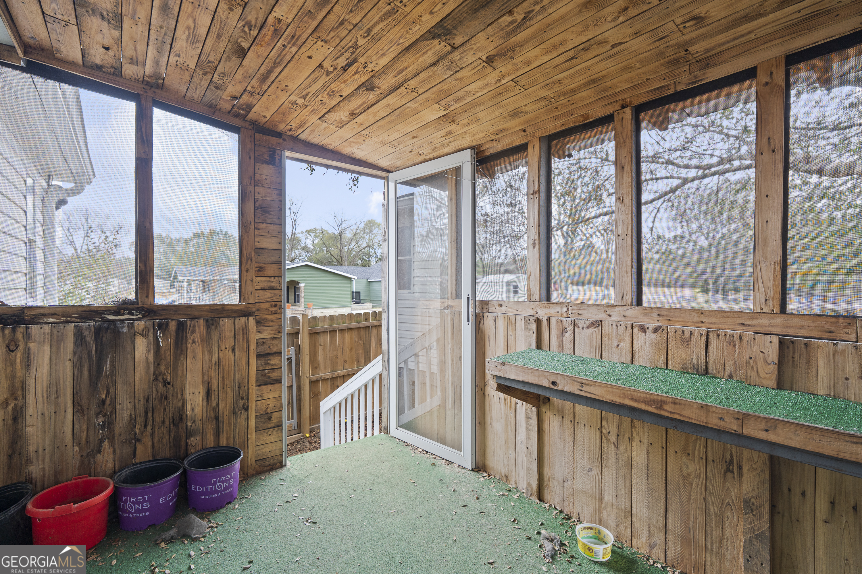 157 Linstead Drive Macon, GA 31216 - Photo 38 of 42 a view of a porch with furniture and floor to ceiling window