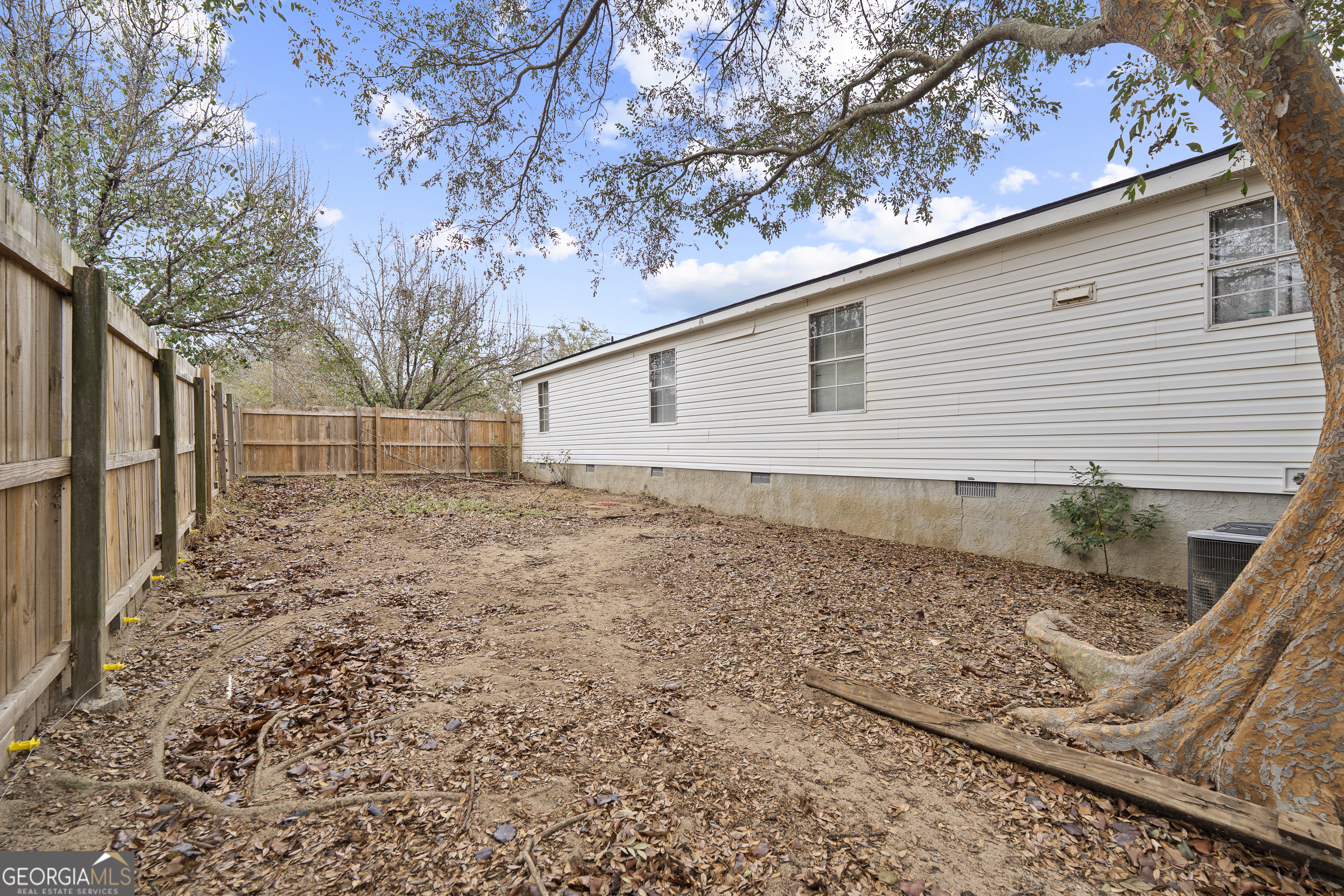 157 Linstead Drive Macon, GA 31216 - Photo 41 of 42 a backyard of a house with large trees