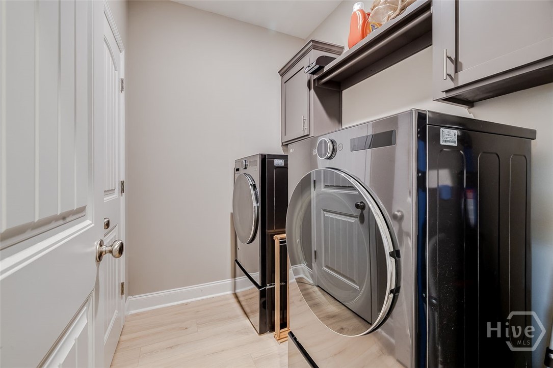 120 Sweetwater Circle Rincon, GA 31326 - Photo 19 of 48 Yes, the LG washer/dryer set convey with home, and this is a great laundry area with built-in cabinets and a walk-in closet.