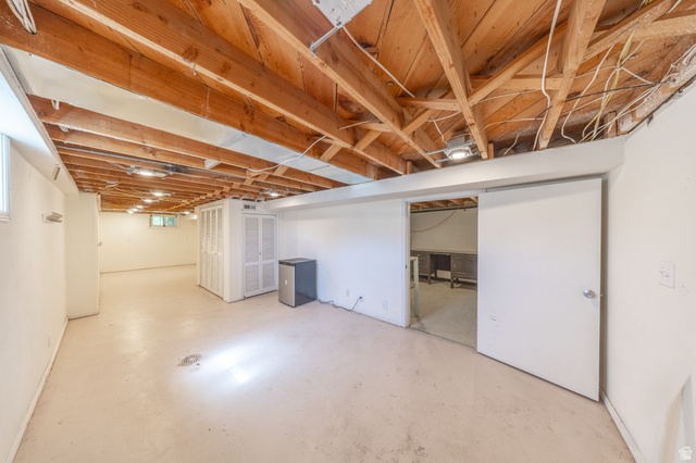 193 Locust Street Clearfield, UT 84015 - Photo 15 of 29 Expansive unfinished basement featuring an exposed wood joist ceiling, painted concrete flooring, and recessed lighting