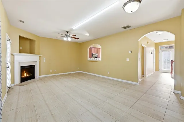 a view of an empty room with a fireplace