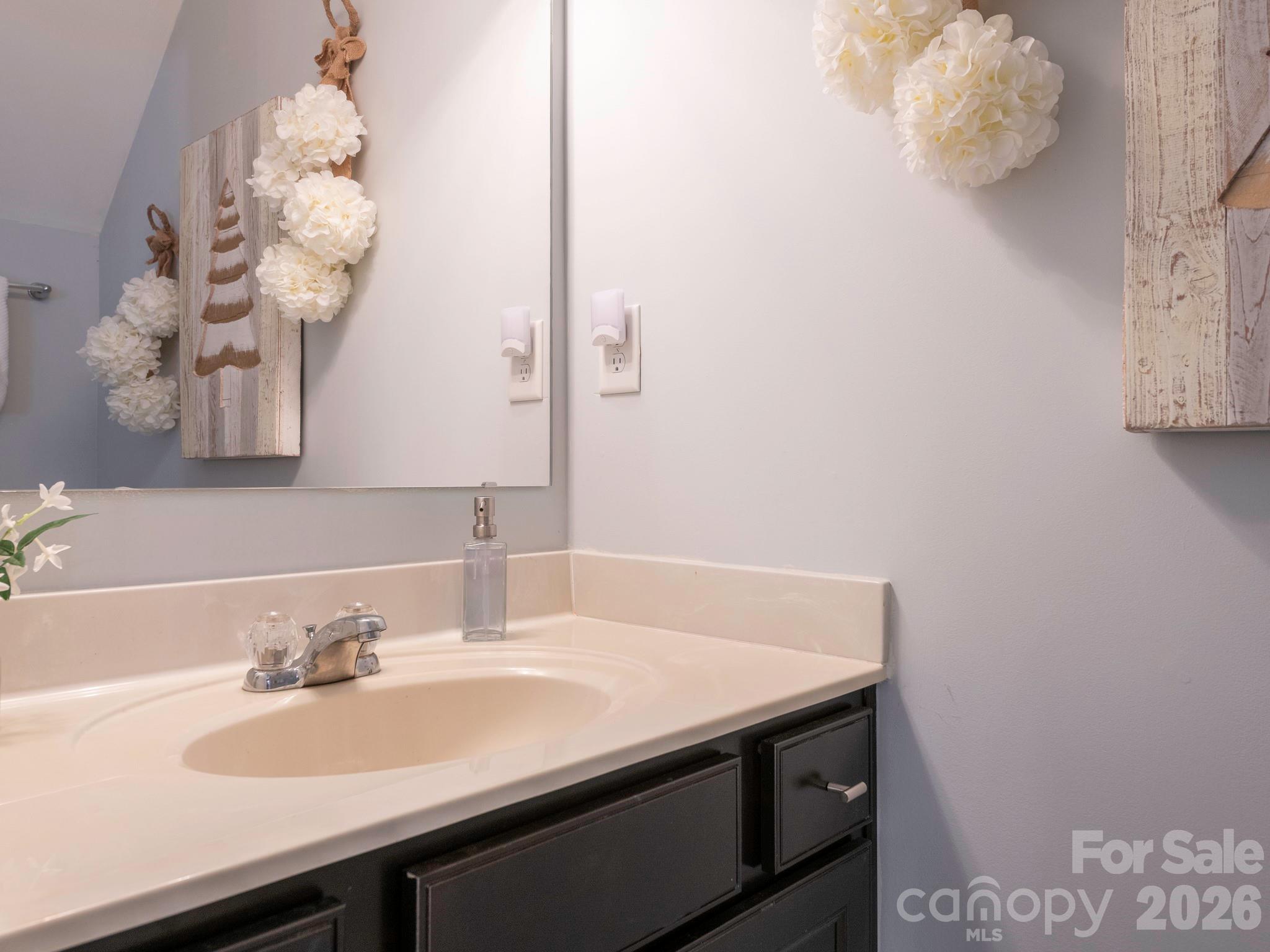 1354 Soothing Court Northwest Concord, NC 28027 - Photo 11 of 22 a bathroom with a sink and a mirror