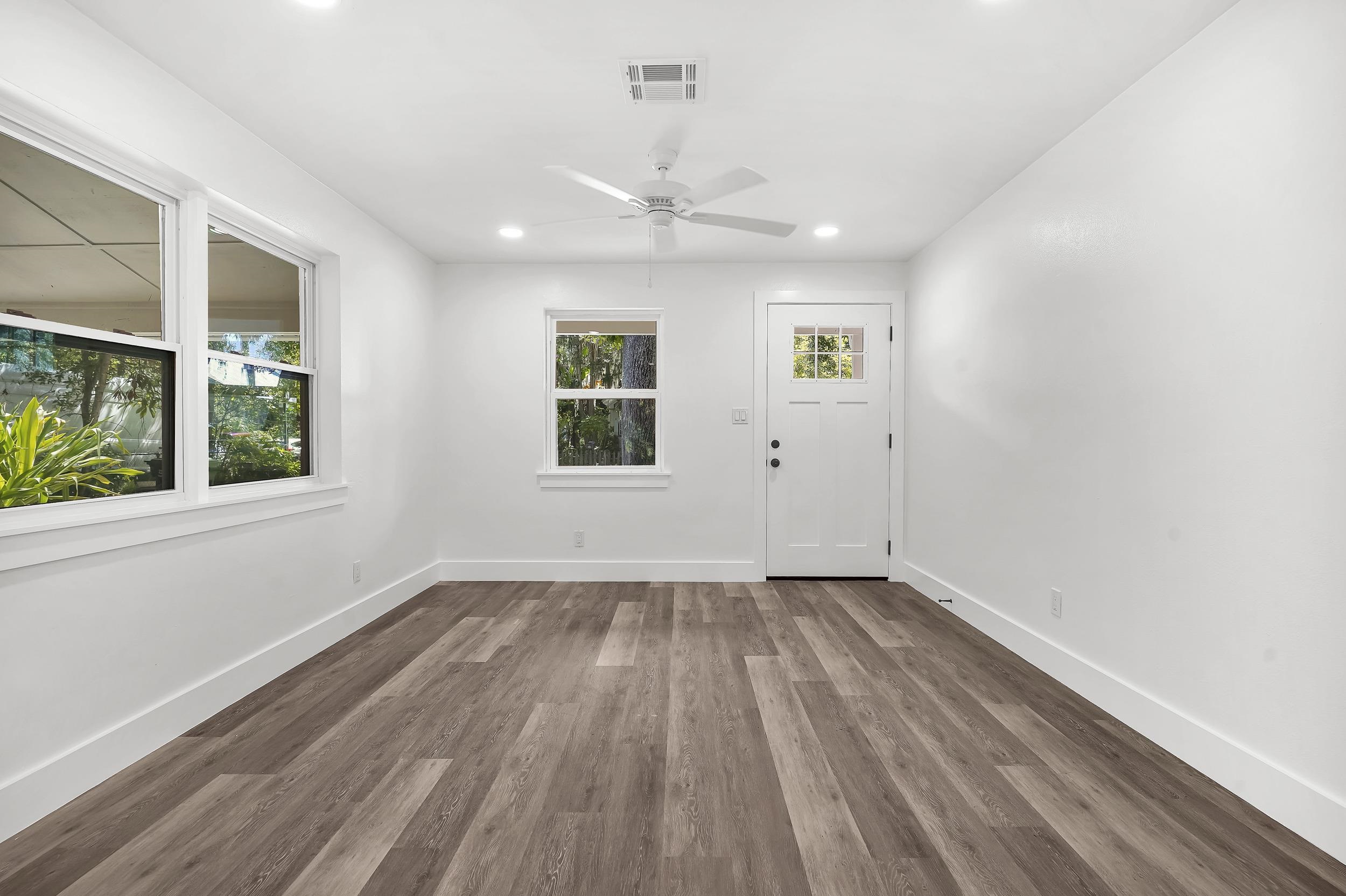 13 Oak Street St. Augustine, FL 32084 - Photo 17 of 39 wooden floor in an empty room with a window