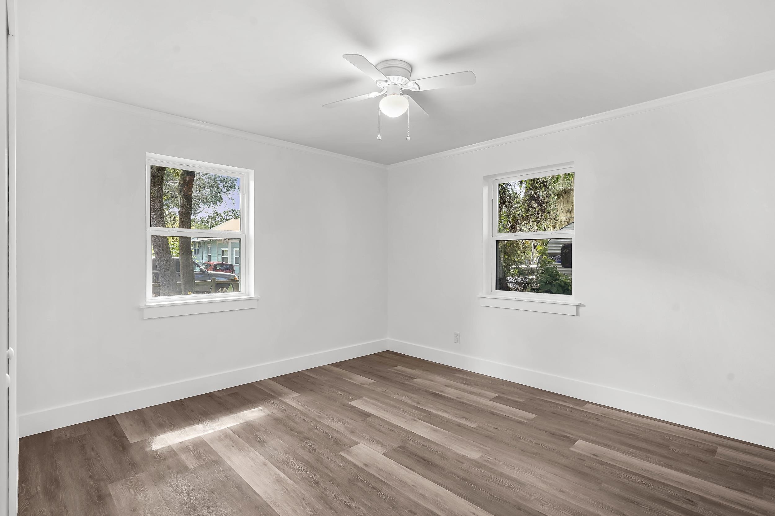 13 Oak Street St. Augustine, FL 32084 - Photo 30 of 39 a view of an empty room with wooden floor and a window
