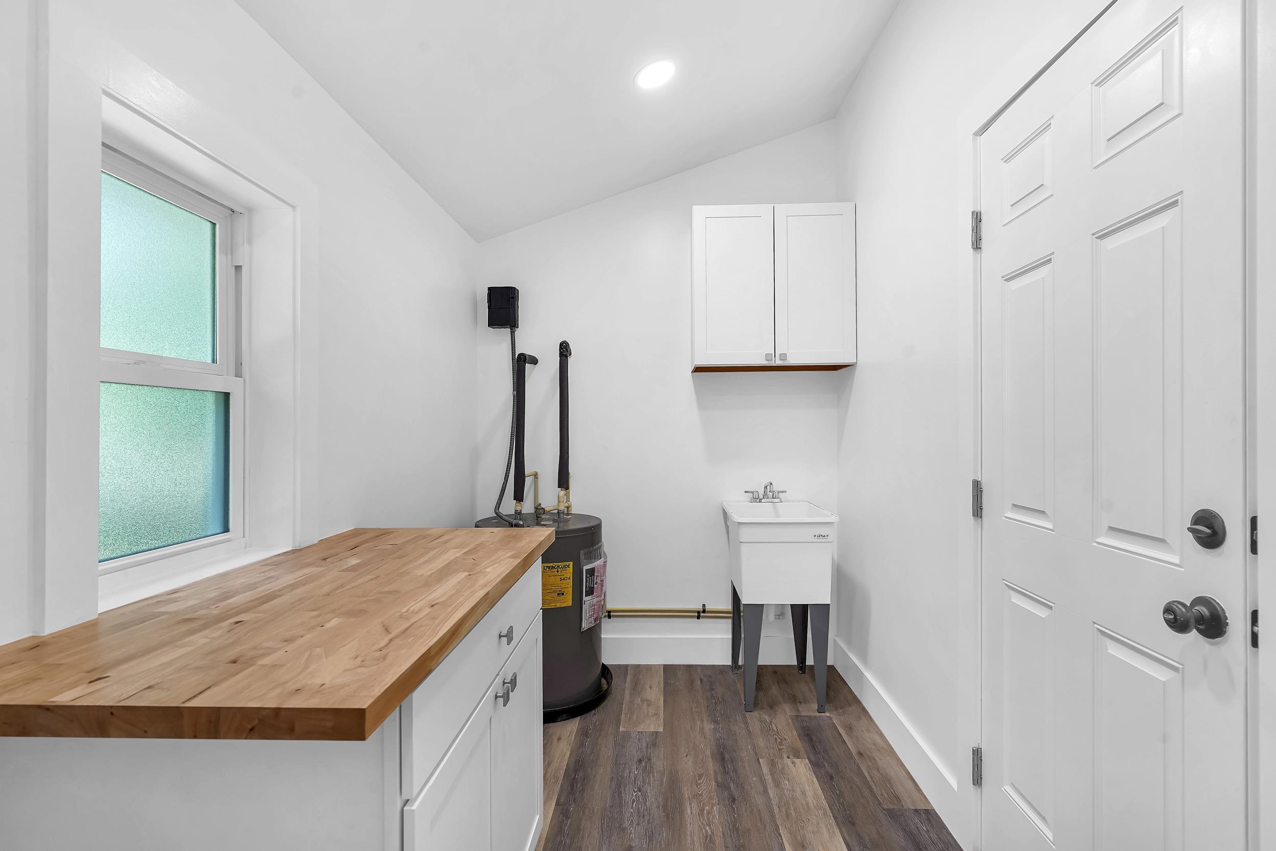 13 Oak Street St. Augustine, FL 32084 - Photo 34 of 39 a bathroom with a sink a toilet and shower