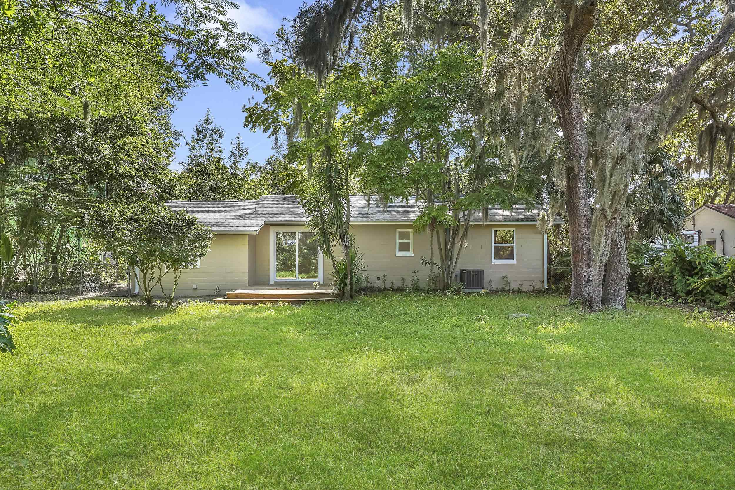 13 Oak Street St. Augustine, FL 32084 - Photo 36 of 39 a view of a backyard with a garden and trees