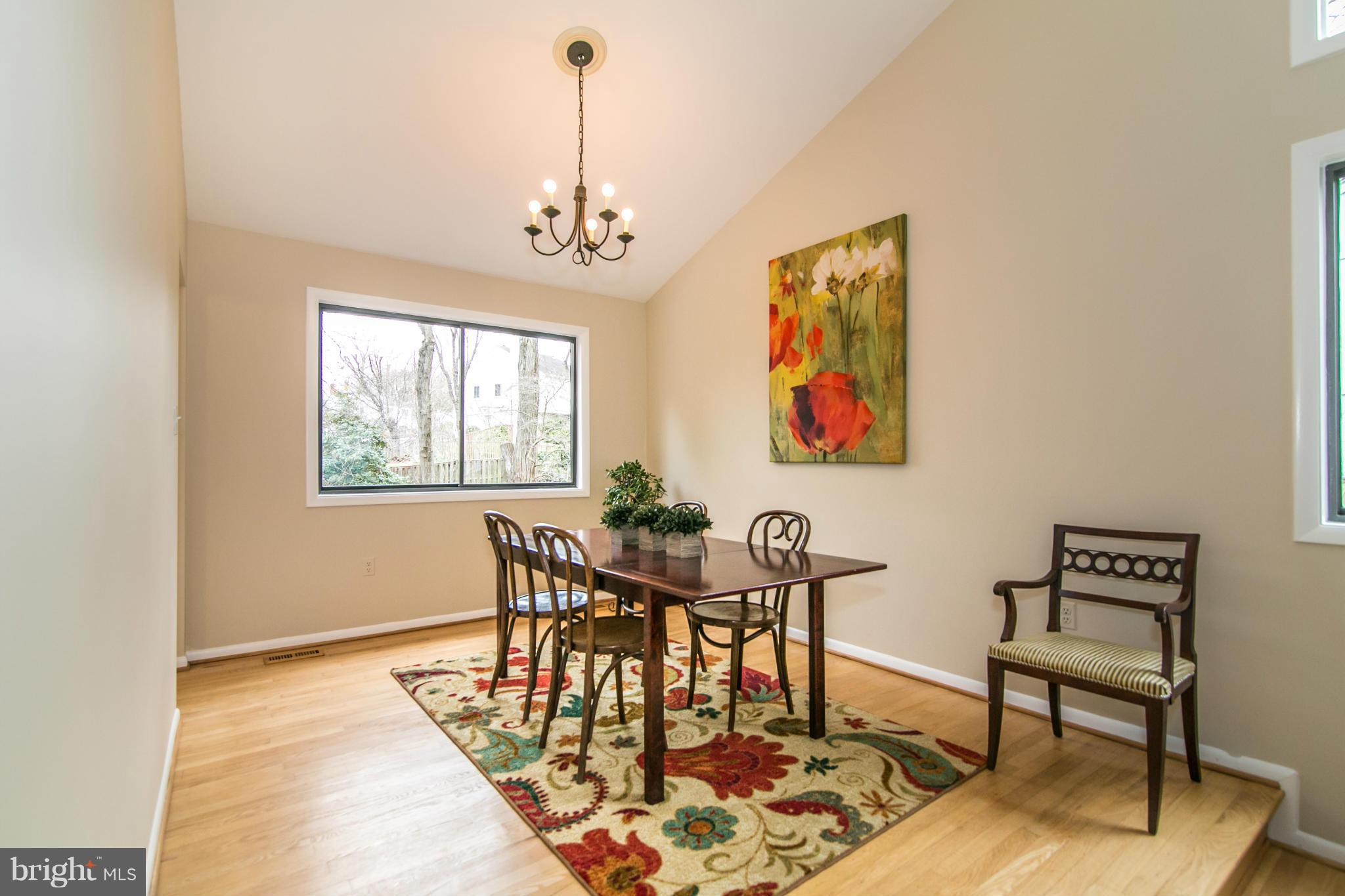 11821 Blue Spruce Road Reston, VA 20191 - Photo 5 of 28 a view of a dining room with furniture window and wooden floor