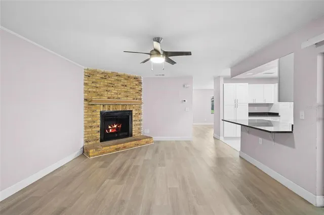 a view of a kitchen with a stove cabinets and wooden floor