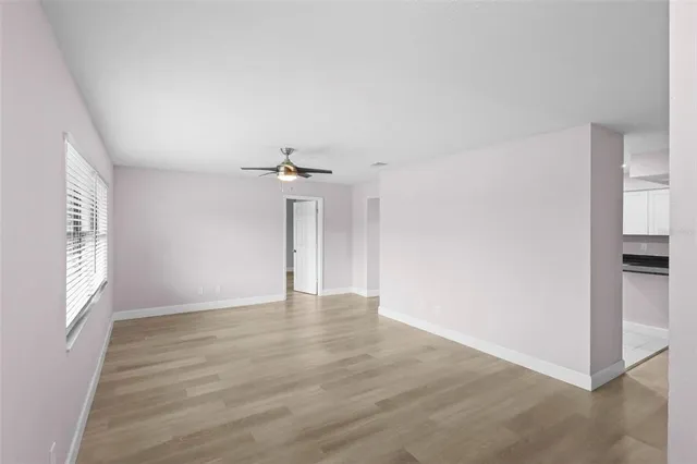 a view of an empty room with a window