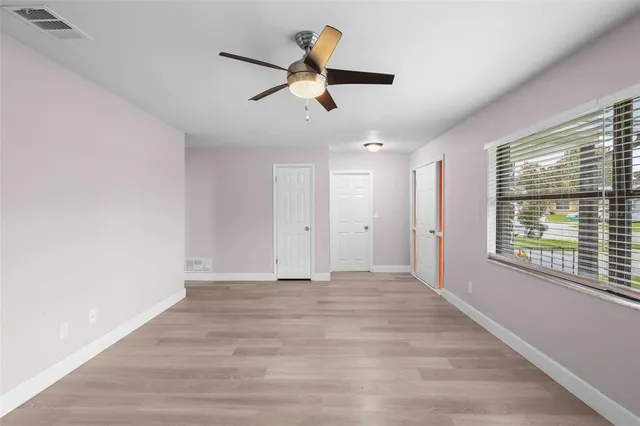 a view of an empty room with a window