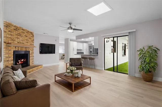 a living room with furniture and a fireplace