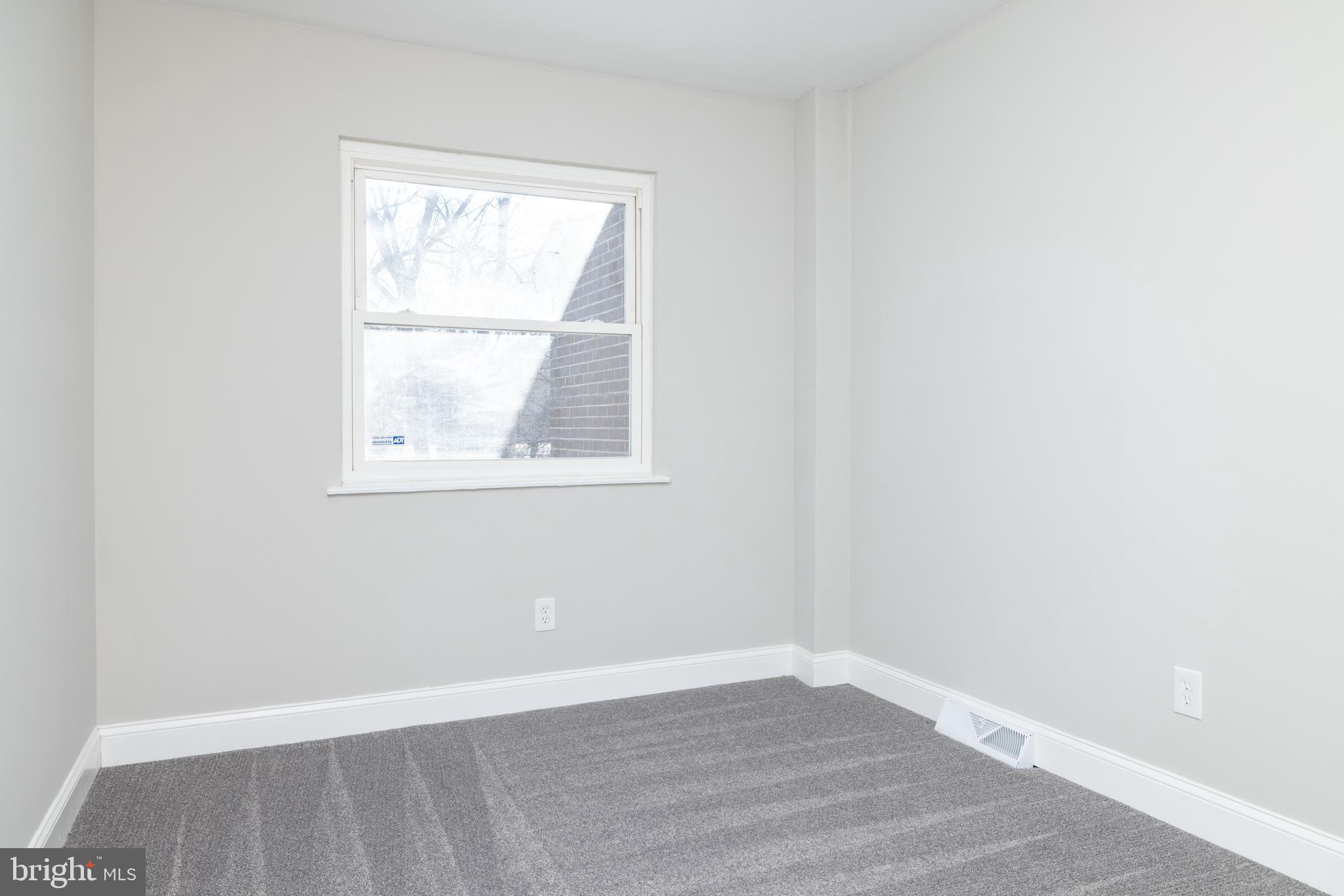 209 West Edgewater Way Newark, DE 19702 - Photo 21 of 34 an empty room with wooden floor and windows
