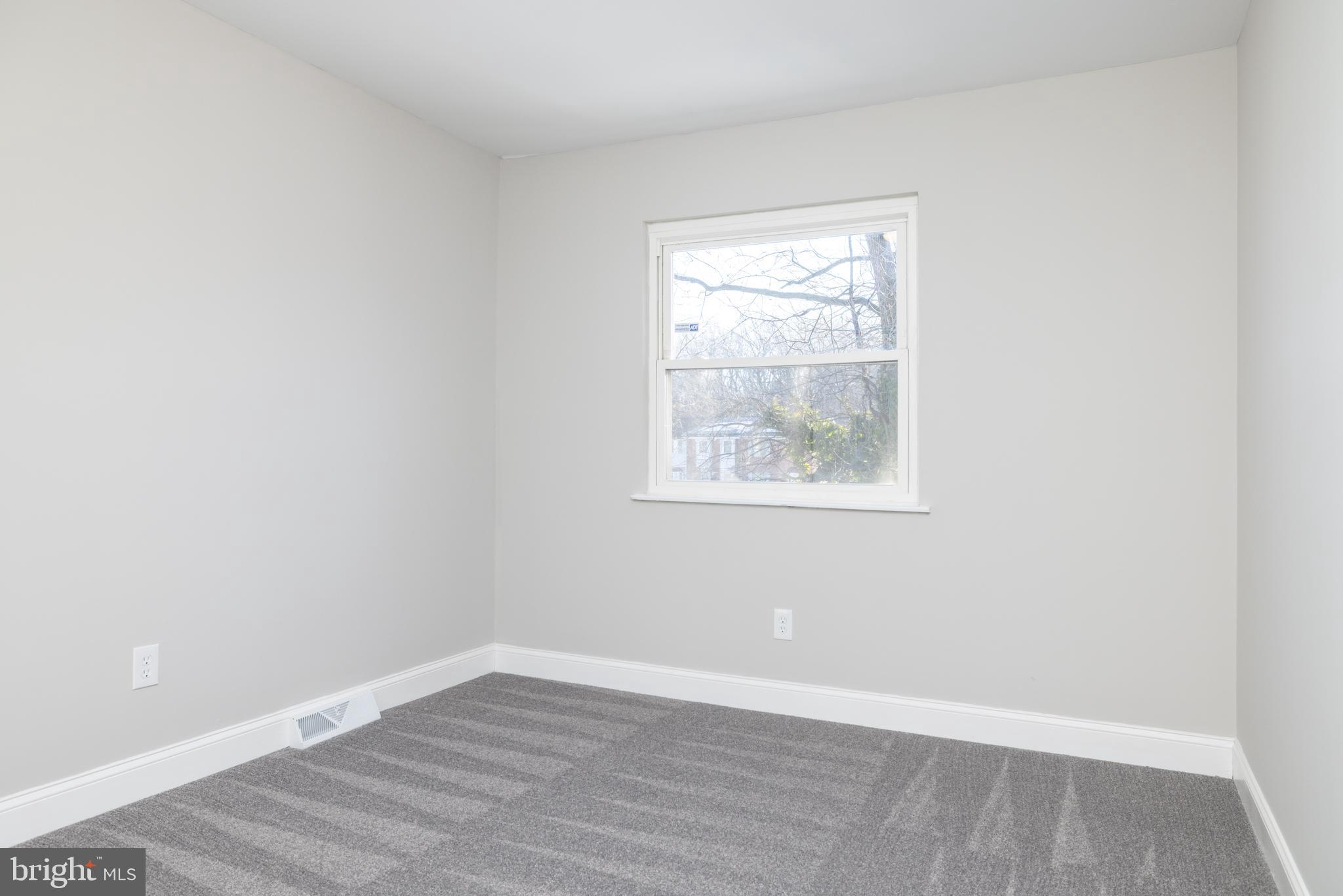 209 West Edgewater Way Newark, DE 19702 - Photo 23 of 34 an empty room with wooden floor and windows