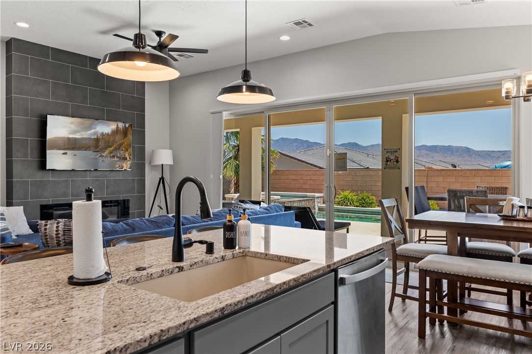 1436 Manassas Ridge Mesquite, NV 89027 - Photo 34 of 77 An open concept living area transitions to an outdoor oasis with mountain vistas.