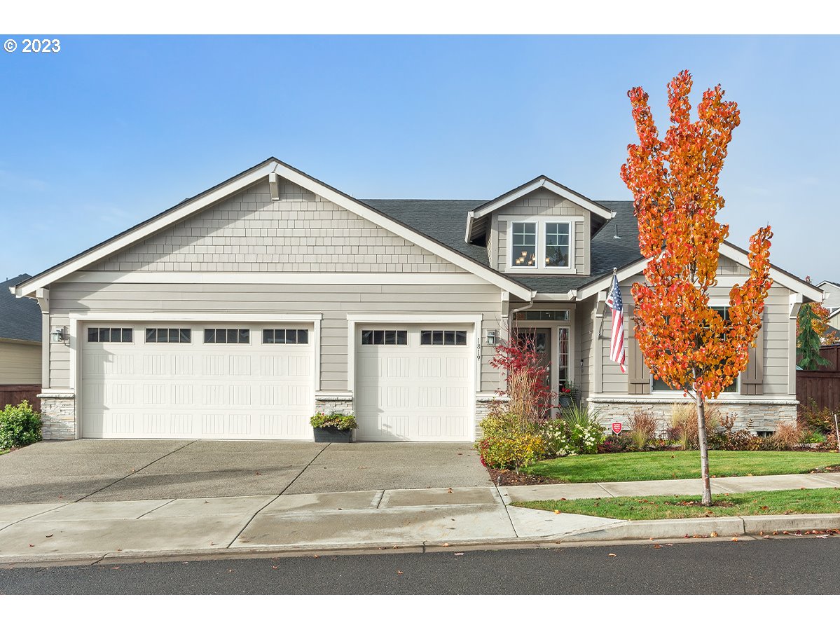 1819 South 50th Place Ridgefield, WA 98642 - Photo 1 of 48 a front view of a house with a yard and garage