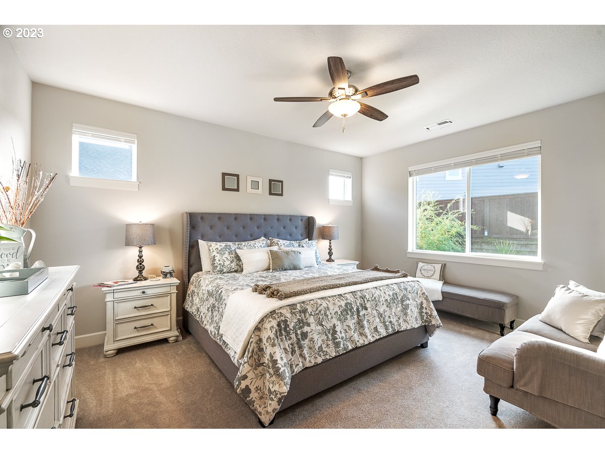 1819 South 50th Place Ridgefield, WA 98642 - Photo 25 of 48 a bedroom with a bed couches and window