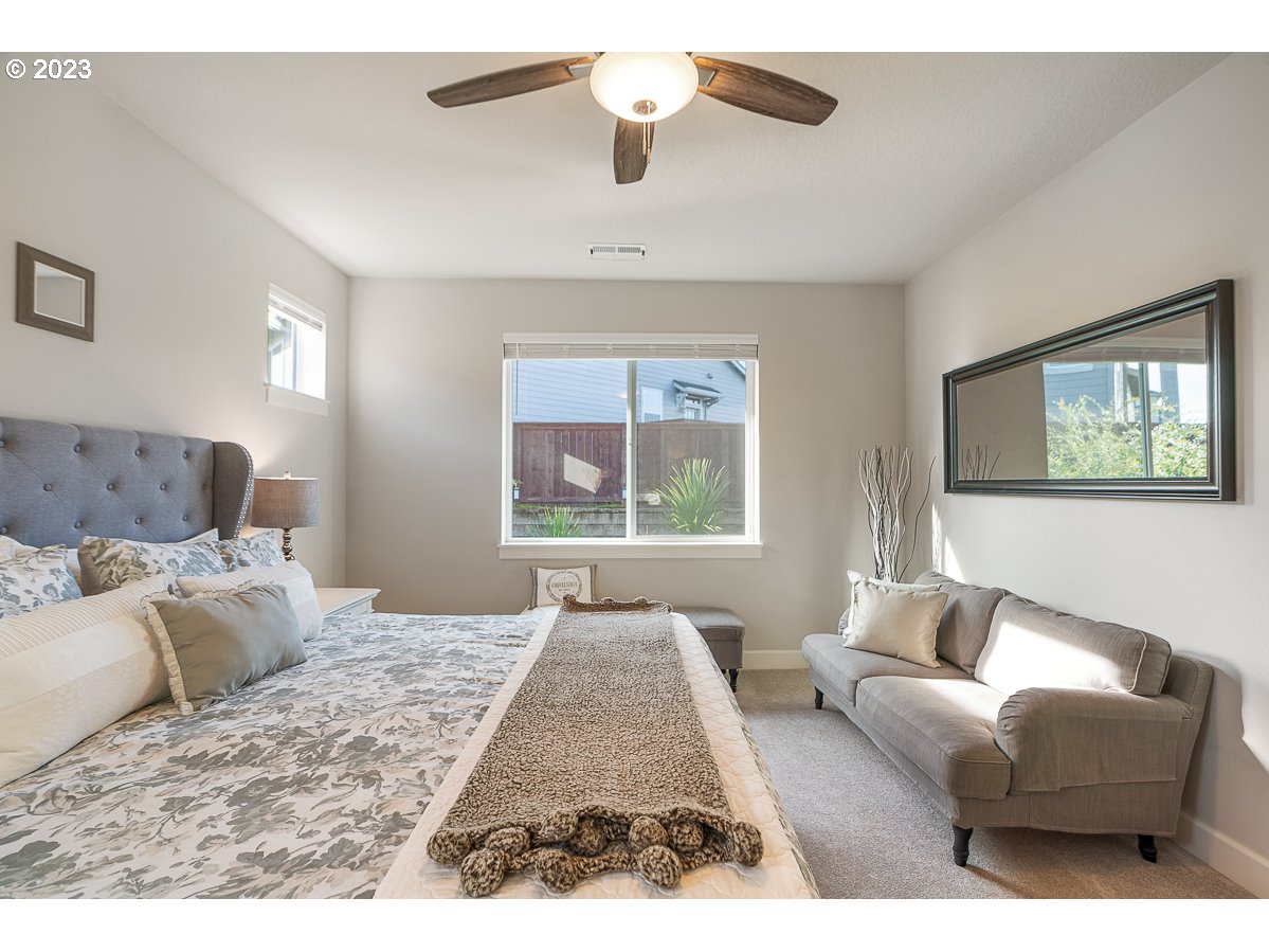 1819 South 50th Place Ridgefield, WA 98642 - Photo 27 of 48 a bedroom with furniture and a window