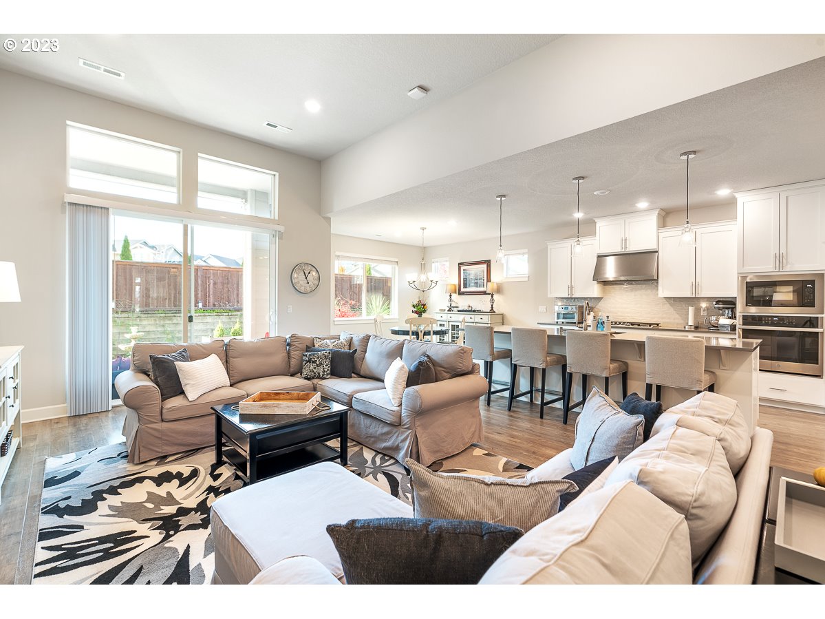 1819 South 50th Place Ridgefield, WA 98642 - Photo 5 of 48 a living room with lots of furniture and a large window