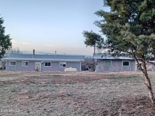 a house view with a backyard space