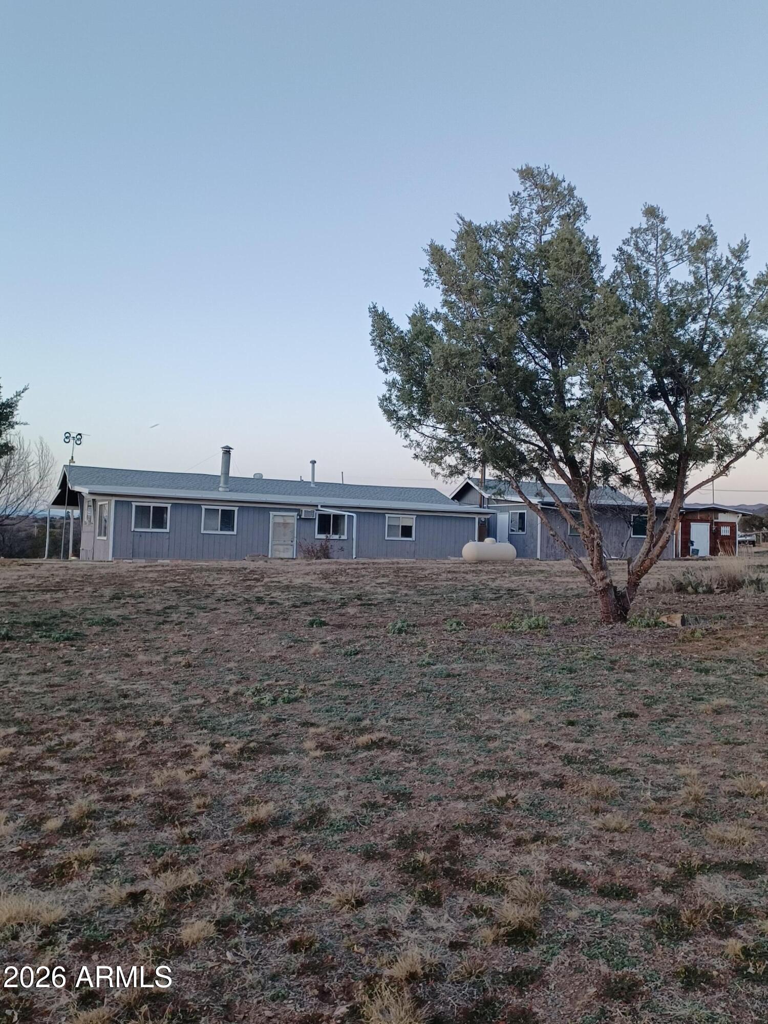14320 East Bradshaw Road Dewey, AZ 86327 - Photo 2 of 19 a view of a large building with large trees