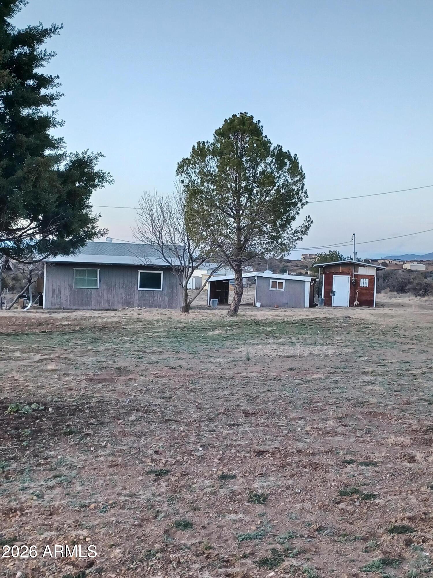14320 East Bradshaw Road Dewey, AZ 86327 - Photo 4 of 19 a front view of a house with a tree