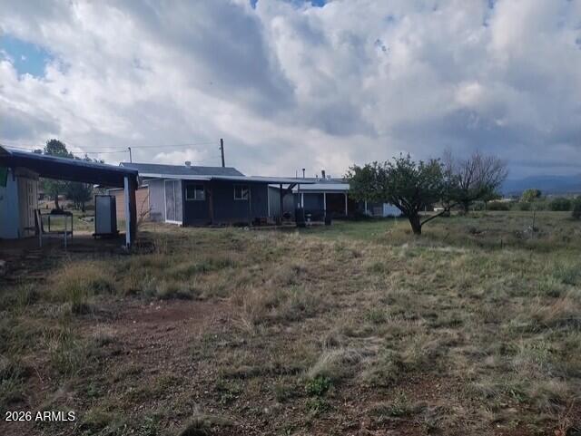 14320 East Bradshaw Road Dewey, AZ 86327 - Photo 7 of 19 a view of a yard with wooden fence