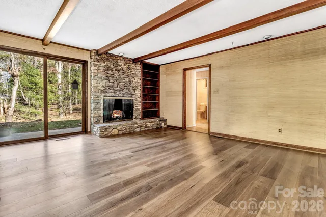 a view of kitchen with furniture and wooden floor