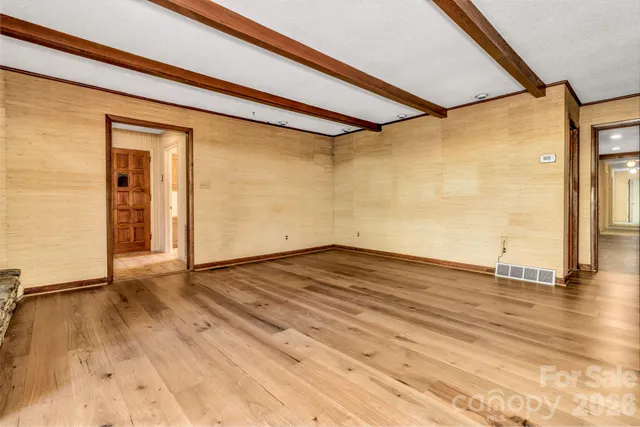 a view of room with wooden floor and outdoor space