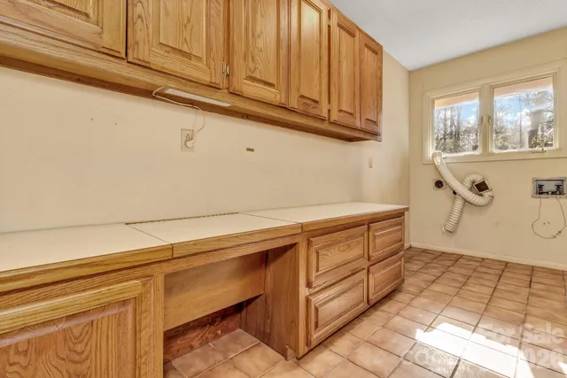 a view of balcony with furniture and wooden fence