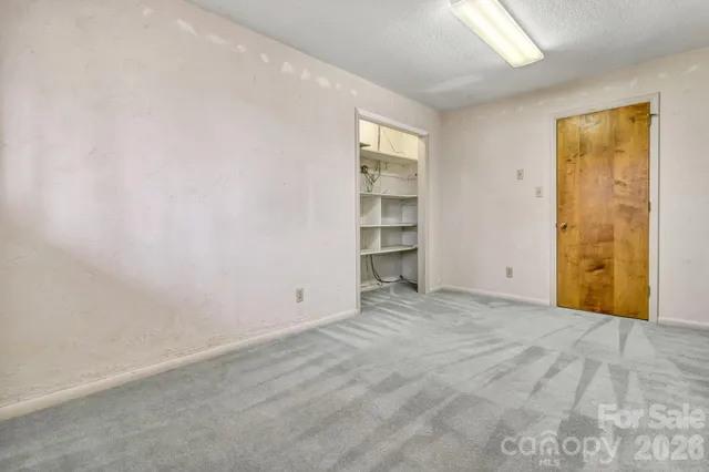 a bathroom with a double vanity sink mirror and bathtub