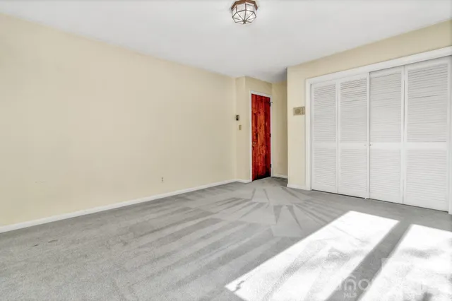 a bathroom with a toilet a sink a mirror a bathtub and shower