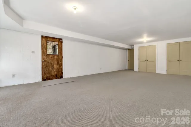 a view of a storage room with wooden walls
