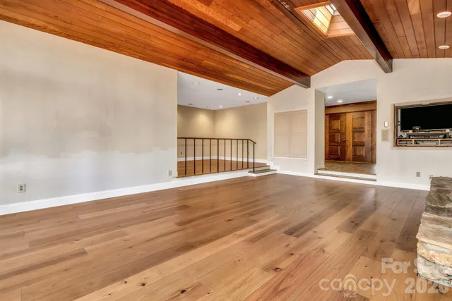 a view of an entryway with wooden floor