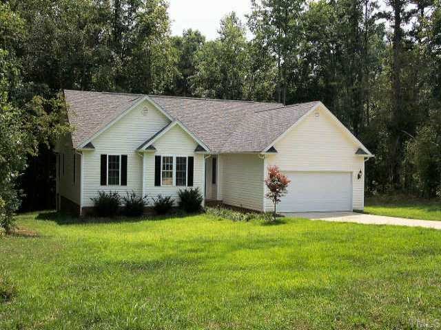 275 Fork Junction Road Timberlake, NC 27583 - Photo 1 of 1 a view of a house with a yard and large trees