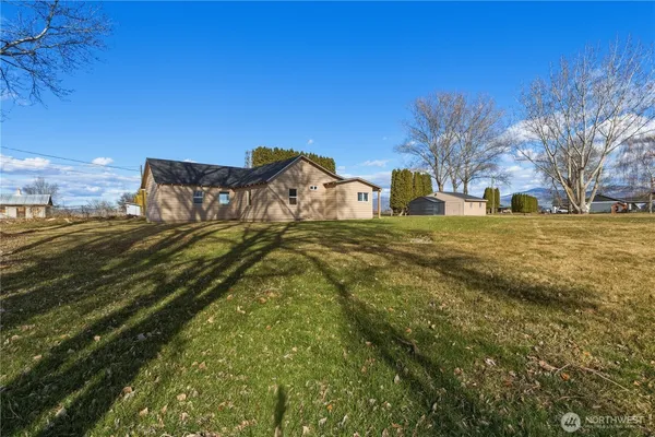 a view of a road with a building in the background