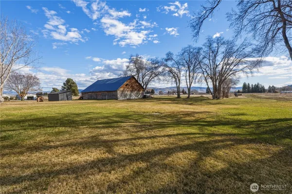 a view of an ocean with a building in the background